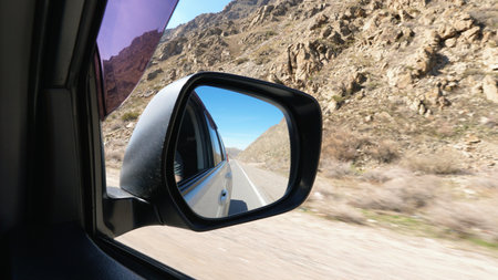 View of the road in the side mirror of the car.の写真素材