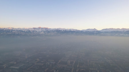 Epic gray smog is visible at sunset over the city