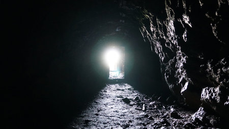 Light and exit at the end of the wet cave