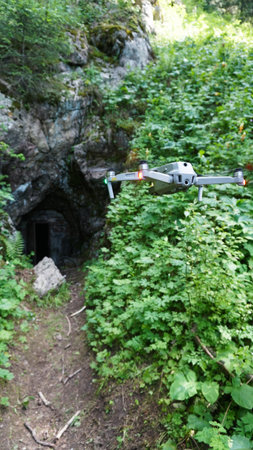 Quadcopter on the background of green rocky gorgeの写真素材