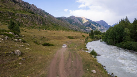 The SUV overcomes the mountain route through gorgeの写真素材