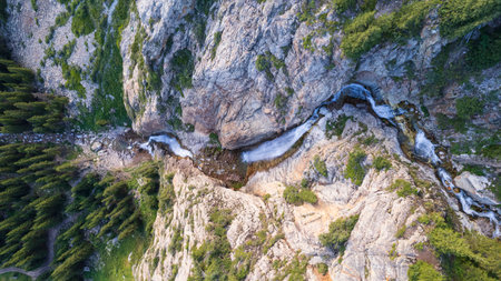 A high waterfall cascades in a mountain gorgeの写真素材