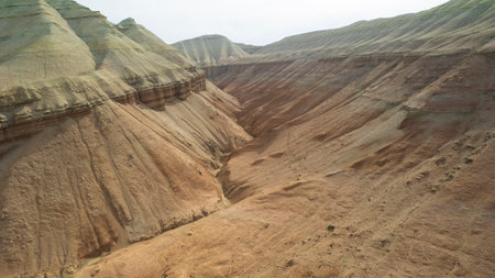 Colorful high mountains and a canyon made of clayの写真素材