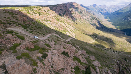 The SUV overcomes the mountain route through gorgeの写真素材