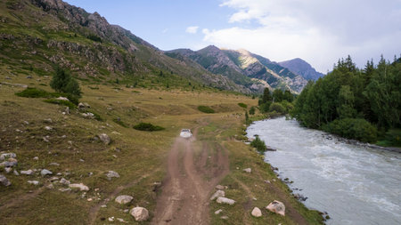 The SUV overcomes the mountain route through gorgeの写真素材