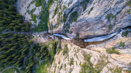 A high waterfall cascades in a mountain gorgeの写真素材