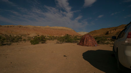 Camping on a bright starry night in the mountainsの写真素材