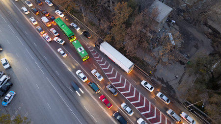 A crossroads with a lot of cars, buses and trucks