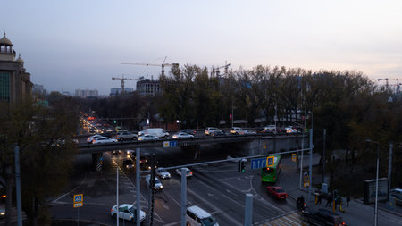 A crossroads with a lot of cars, buses and trucksの写真素材
