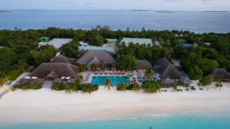 White sand on the beach and a large swimming poolの写真素材