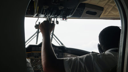 Pilot maneuvering aircraft from cockpit during flight