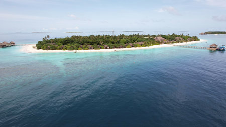 Tropical island resort in maldives embraces tranquil turquoise watersの写真素材