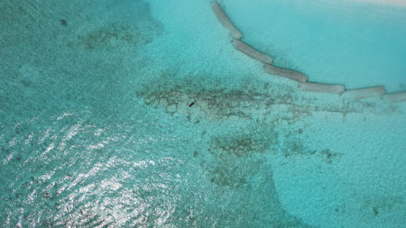 Aerial view of crystal clear turquoise water and artificial reefsの写真素材