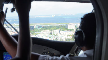 Two pilots flying over male, maldives, on a seaplaneの写真素材