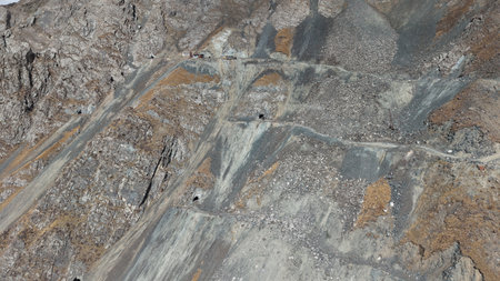 Aerial view of rocky terrain with mining roads and mineral depositsの写真素材