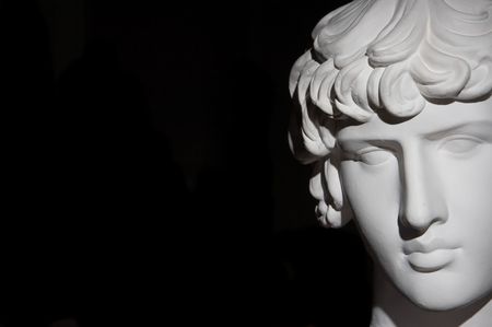 Plaster head of sculpture, black backgroundの写真素材