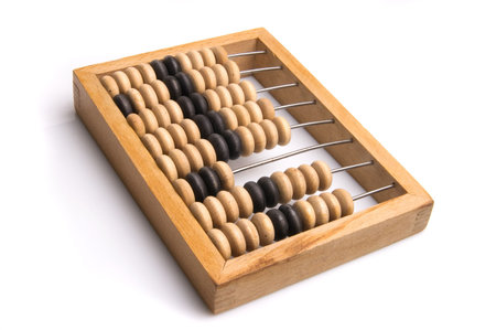 Obsolete wooden abacus, white background