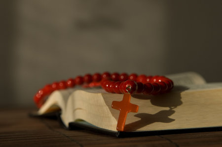 Book and red beads with crossの写真素材