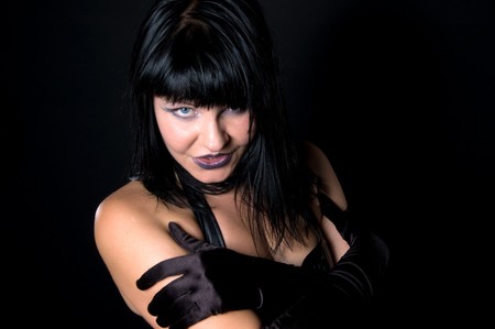 Portrait of smiling gothic woman with black hairの写真素材