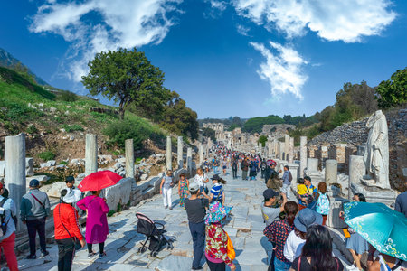 People are observing ruins of Celsus in Ephesus Ancient City in Turkey