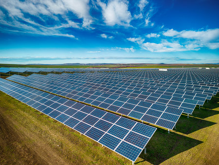 Solar panel produces green, environmentaly friendly energy from the setting sun. Aerial view from...