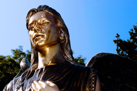 Bronze Angel in the bright sunshineの写真素材