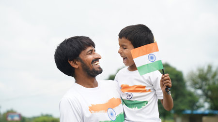 Cute Little smiling boy with his father with indian flag. Celebrating Independnce day or Republic day.. Har Ghar Tirangaの写真素材