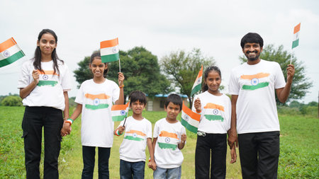 Group of  student or kids wearing indian tricolor Tshirt, face painted with triclolor and saluting....
