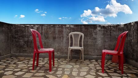 Chairs on the roof with sky backgroundの写真素材