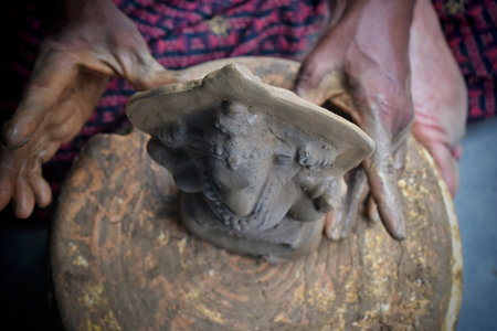 A clay and hay made incomplete idol of lord Ganesha under construction at a shop. Ganesh chaturthi is the first hindu festival of the yearの写真素材