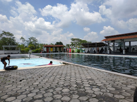 Peaceful atmosphere in a beautiful public swimming pool with clear and refreshing pool water conditionsのeditorial素材