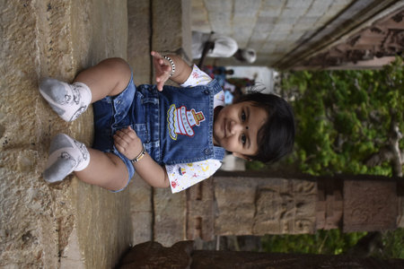 A cute little baby girl in joy mood