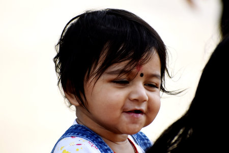 A cute little baby girl in joy mood