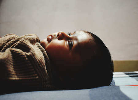 A cute little baby girl in joy moodの写真素材