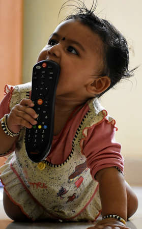 A cute little baby girl in joy moodの写真素材