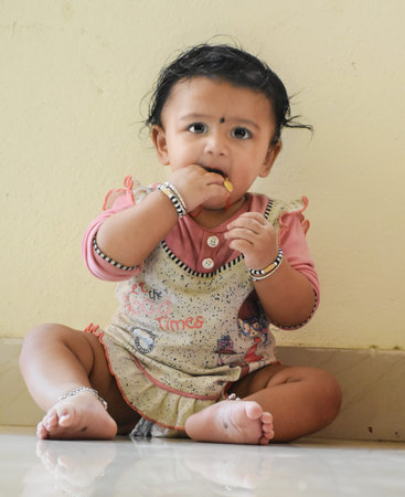A cute little baby girl in joy mood