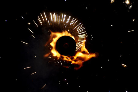 fire sparks from a welding torch on a black background close-upの写真素材