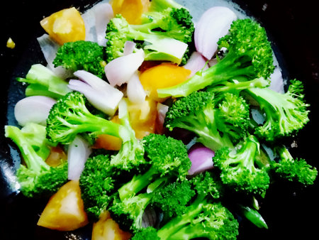 Vegetable salad with broccoli, red onion, corn and tomatoesの写真素材
