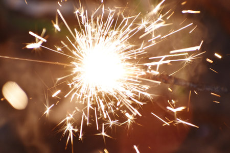 sparkler on the dark background, close-up, shallow depth of fieldの写真素材