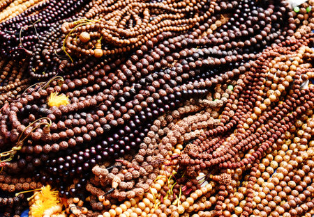 Buddhist beads for sale at a market stall in India.の写真素材