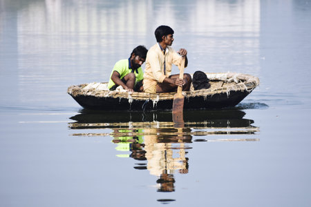 Unidentified people on boat in Kolkata, West Bengal, India.