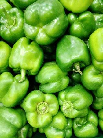 Green bell pepper background. Closeup of green bell pepper background.の写真素材