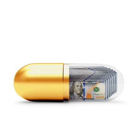 Golden medical capsule with dollar bills inside isolated on white backgroundの写真素材