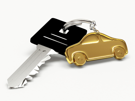 Key with golden car figure isolated on white backgroundの写真素材