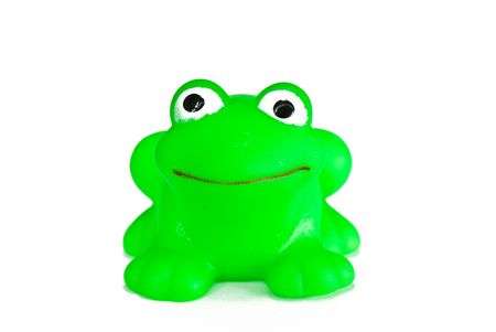 green rubber toy frog for bathing on a white backgroundの写真素材