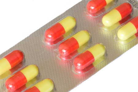 packs of vitamins on the white isolated background
