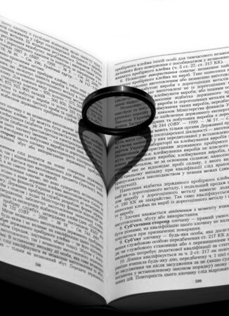 Shade in the form of heart on the bookの写真素材