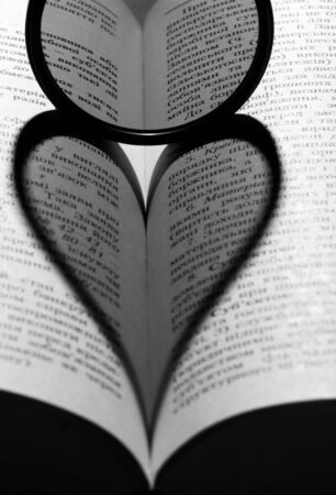 Shade in the form of heart on the bookの写真素材
