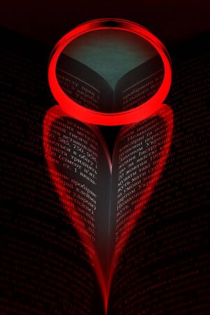 Shade in the form of heart on the bookの写真素材