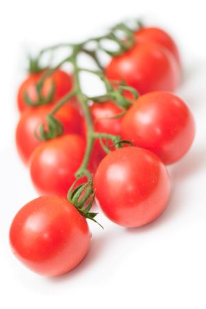 Cluster of cherry  tomatoes on the white isolated backgroundの写真素材